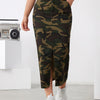 Fashionable camo denim midi skirt with slant pockets and side split, perfect for casual outfits.