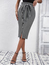 Chic houndstooth print bodycon skirt with tie waist and button detail, perfect for spring and fall women's fashion.