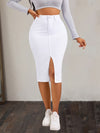 High-rise white denim skirt with front slit, styled with a gray crop top and white sneakers for a casual look.