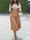 Elegant pleated high waist split skirt in brown, paired with a fitted top and handbag, perfect for fall/winter fashion.