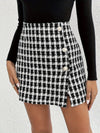 Elegant plaid asymmetrical skirt with button details, perfect for fall/winter, versatile for casual or formal wear.