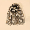 Elegant leaf pattern organza scarf in black, lightweight and breathable, perfect accessory for spring and summer styling.