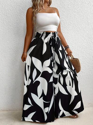 [1pc Plus Size Floral Wide-Leg Culottes] Plus Size Floral Print Asymmetrical Skirt Pants, Polyester Blend with Slight Stretch, Elegant Wide-Leg Culottes for All Seasons